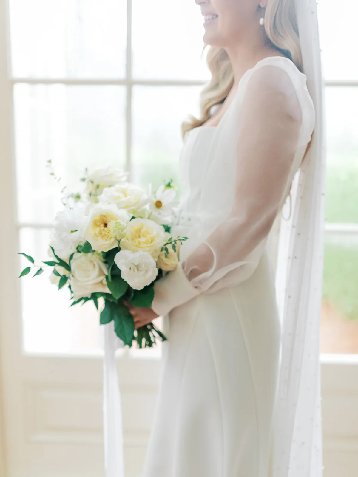 Bride holding flower bouquet