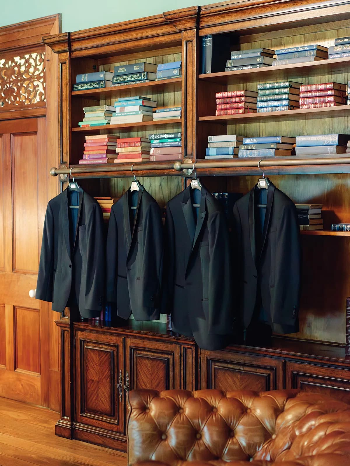 Groomsmen jackets hanging in library