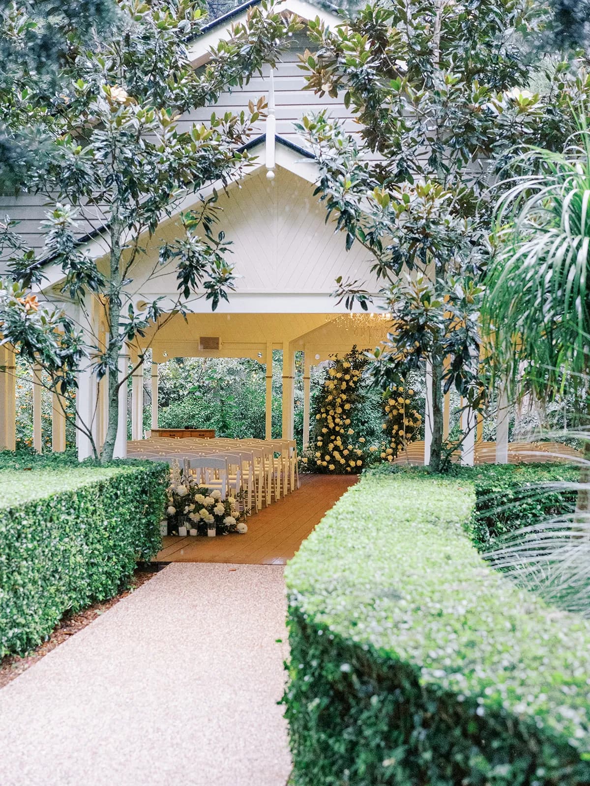 Wedding ceremony with white flowers and chairs