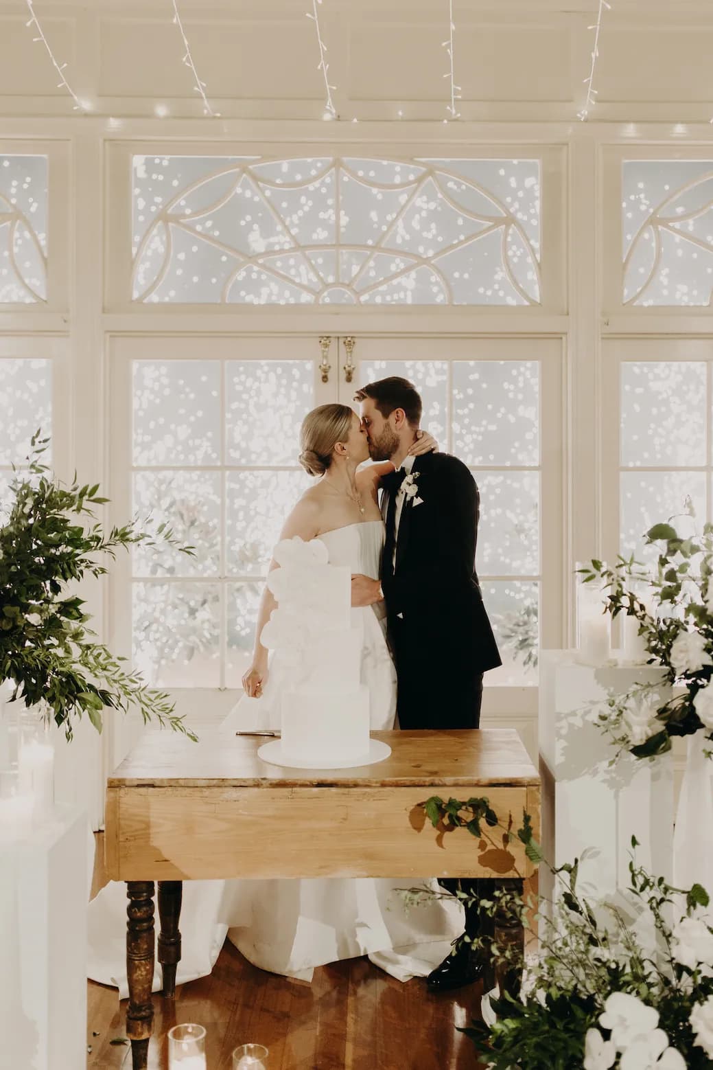 Bride and groom cutting cake