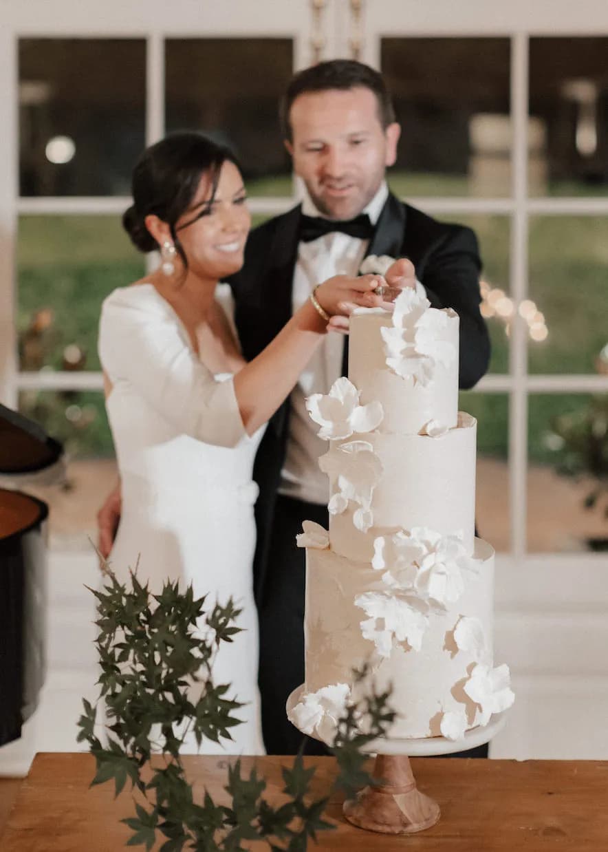 Bride and groom cutting cake