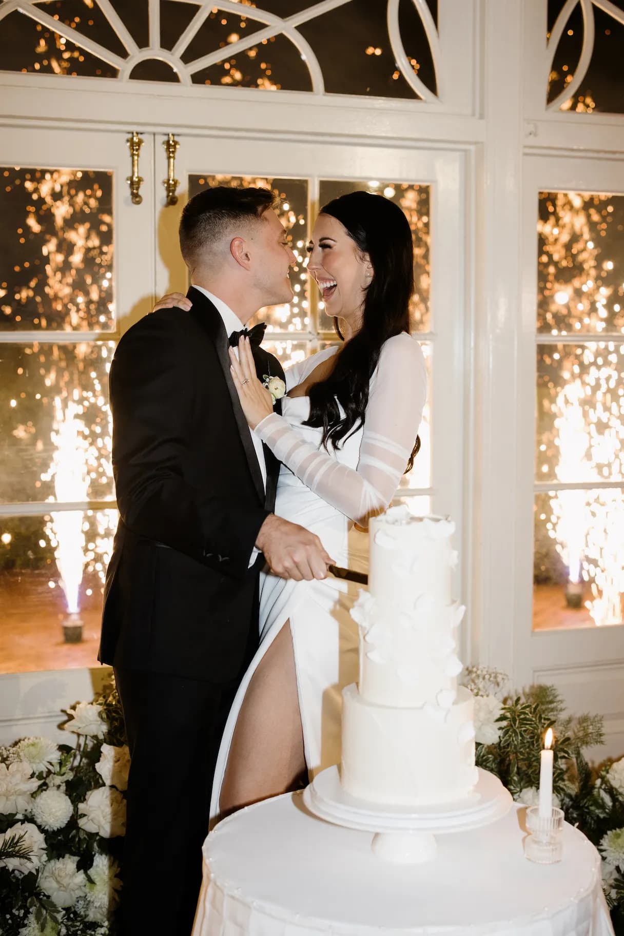 Bride and groom cutting cake