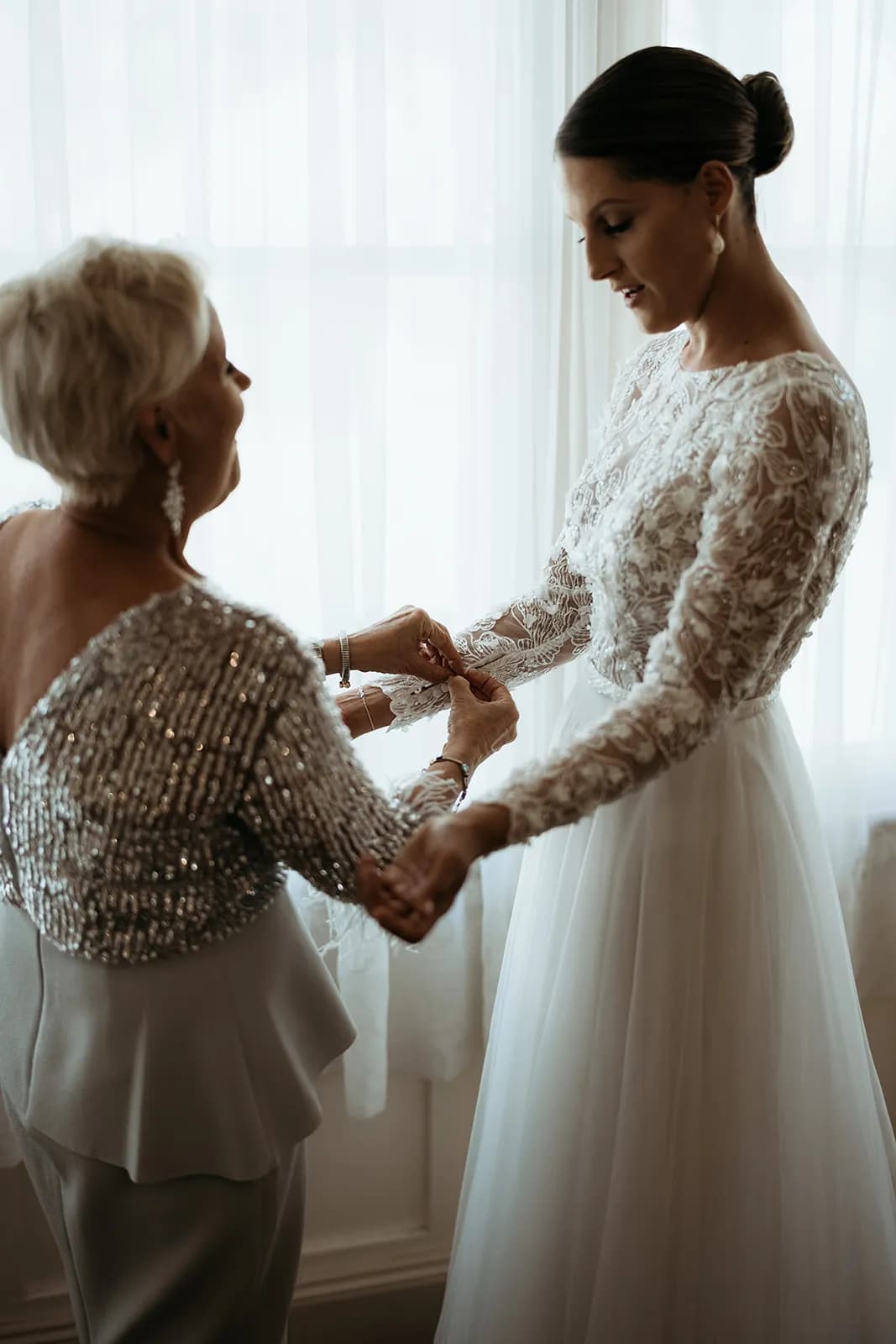 Bride and mother of bride getting ready