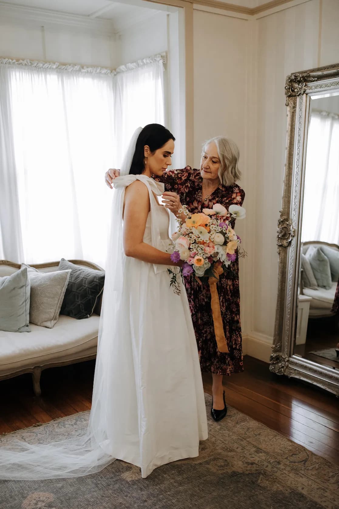 Bride and mother of bride getting ready