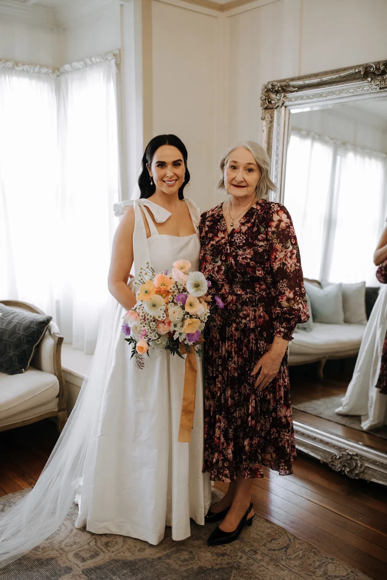 Bride and mother of bride getting ready