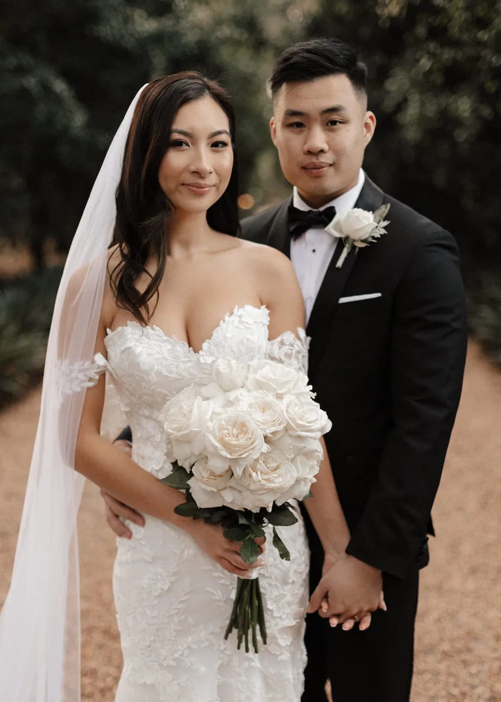 Bride and groom holding hands