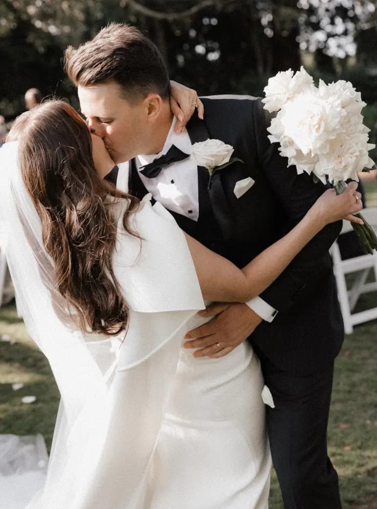 Couple kiss after ceremony