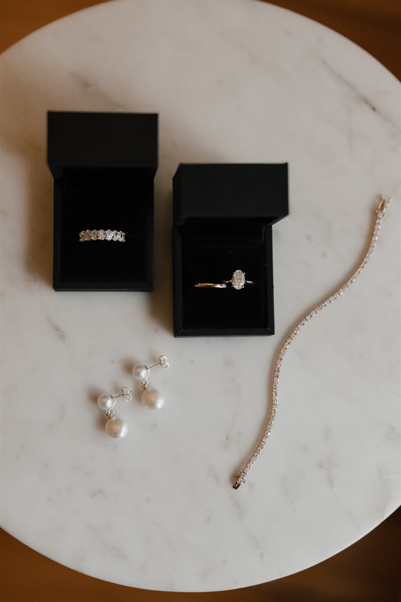 Wedding rings and jewellery on table