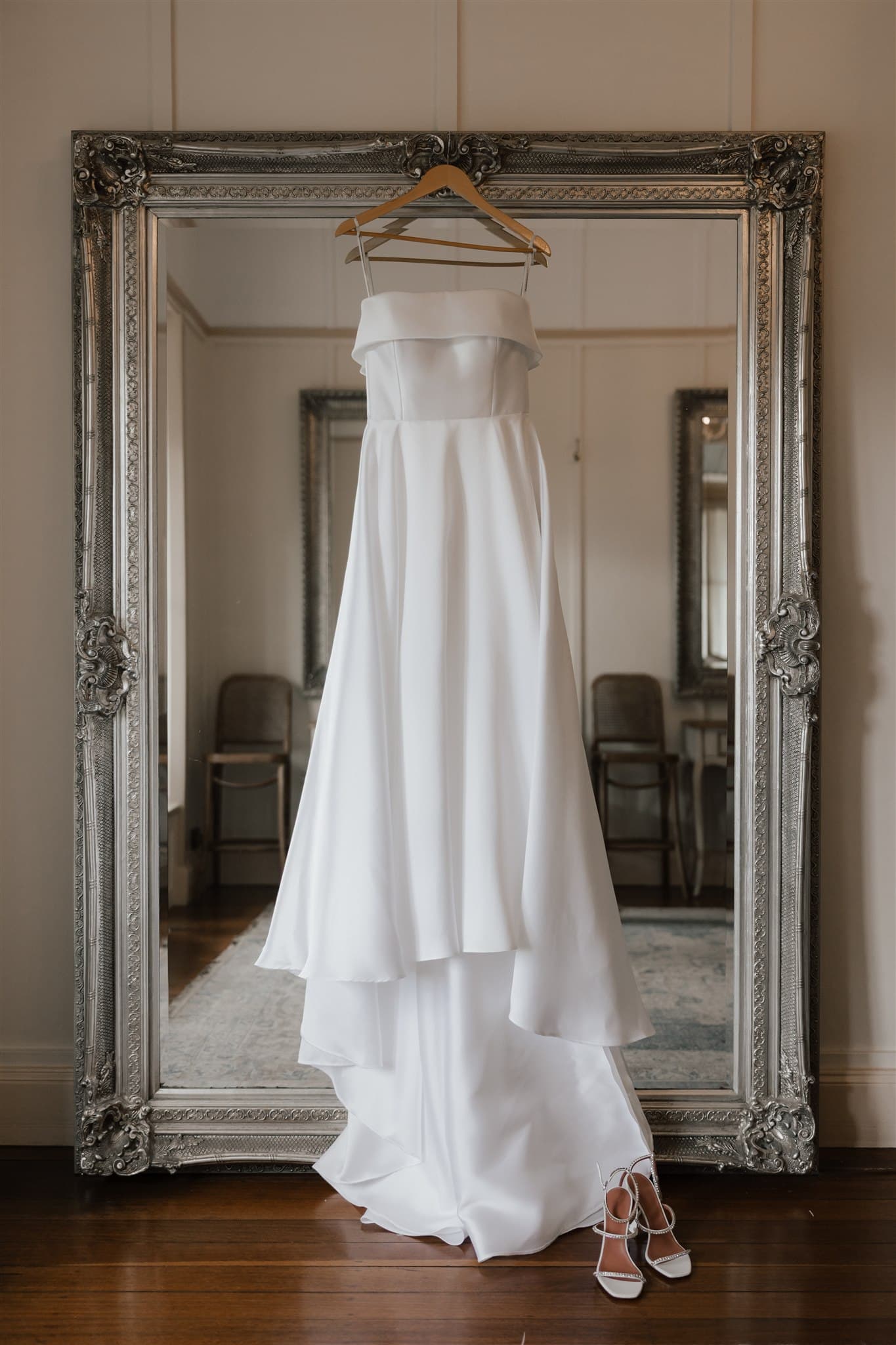 Wedding dress hanging on a mirror