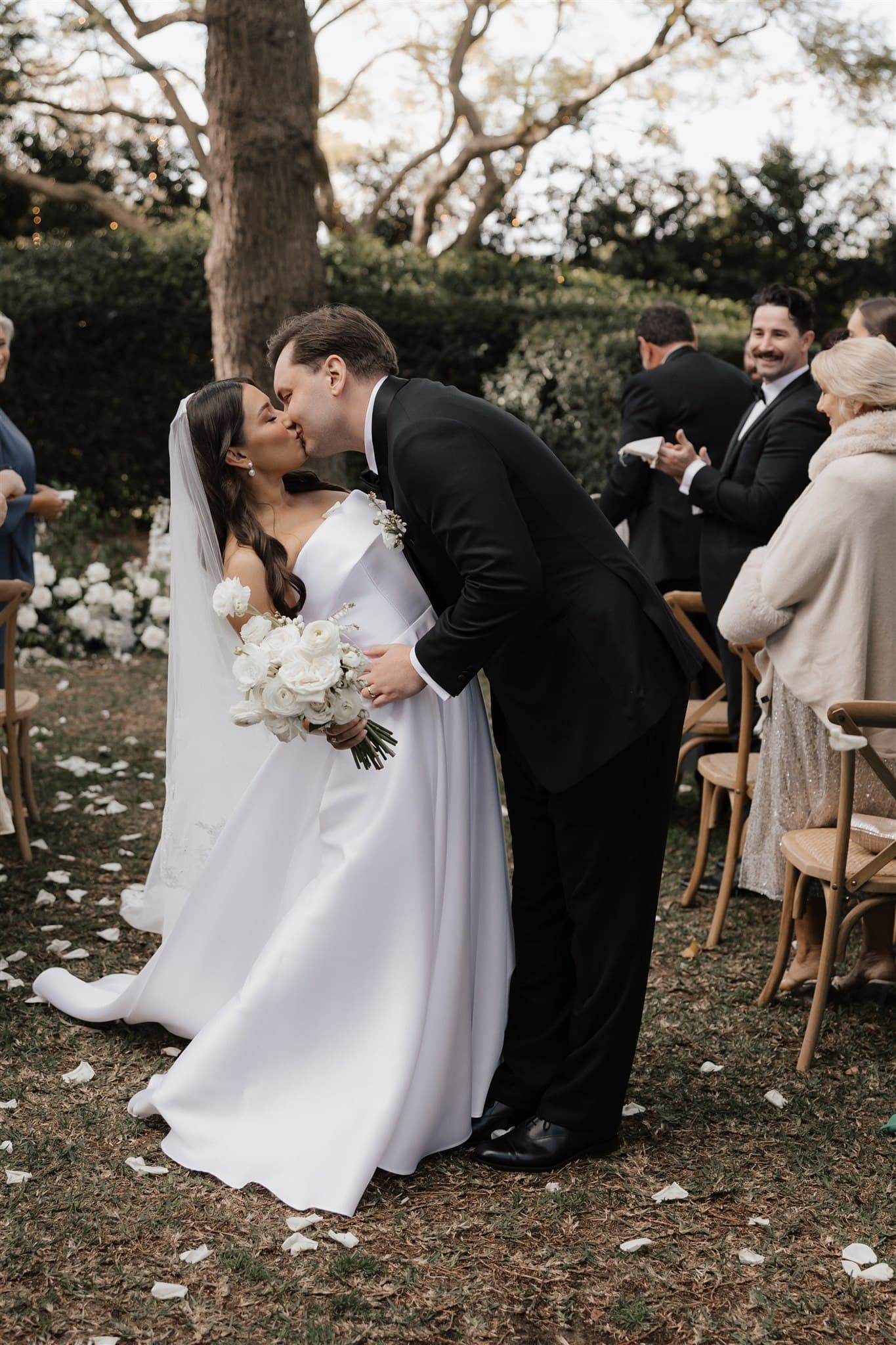 Bride and groom kissing after ceremony