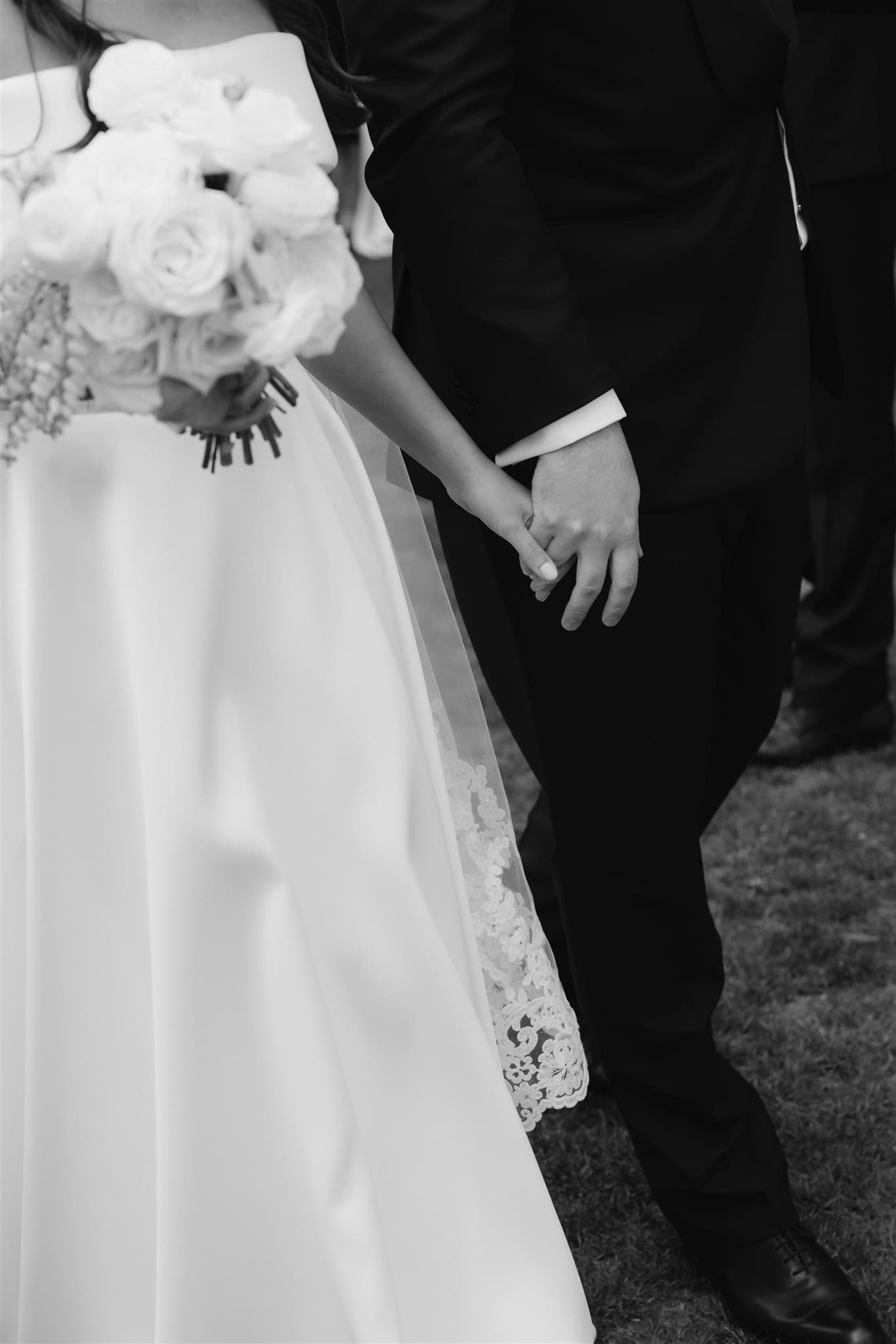 Bride and groom holding hands