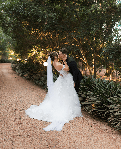 Couple kiss on the driveway