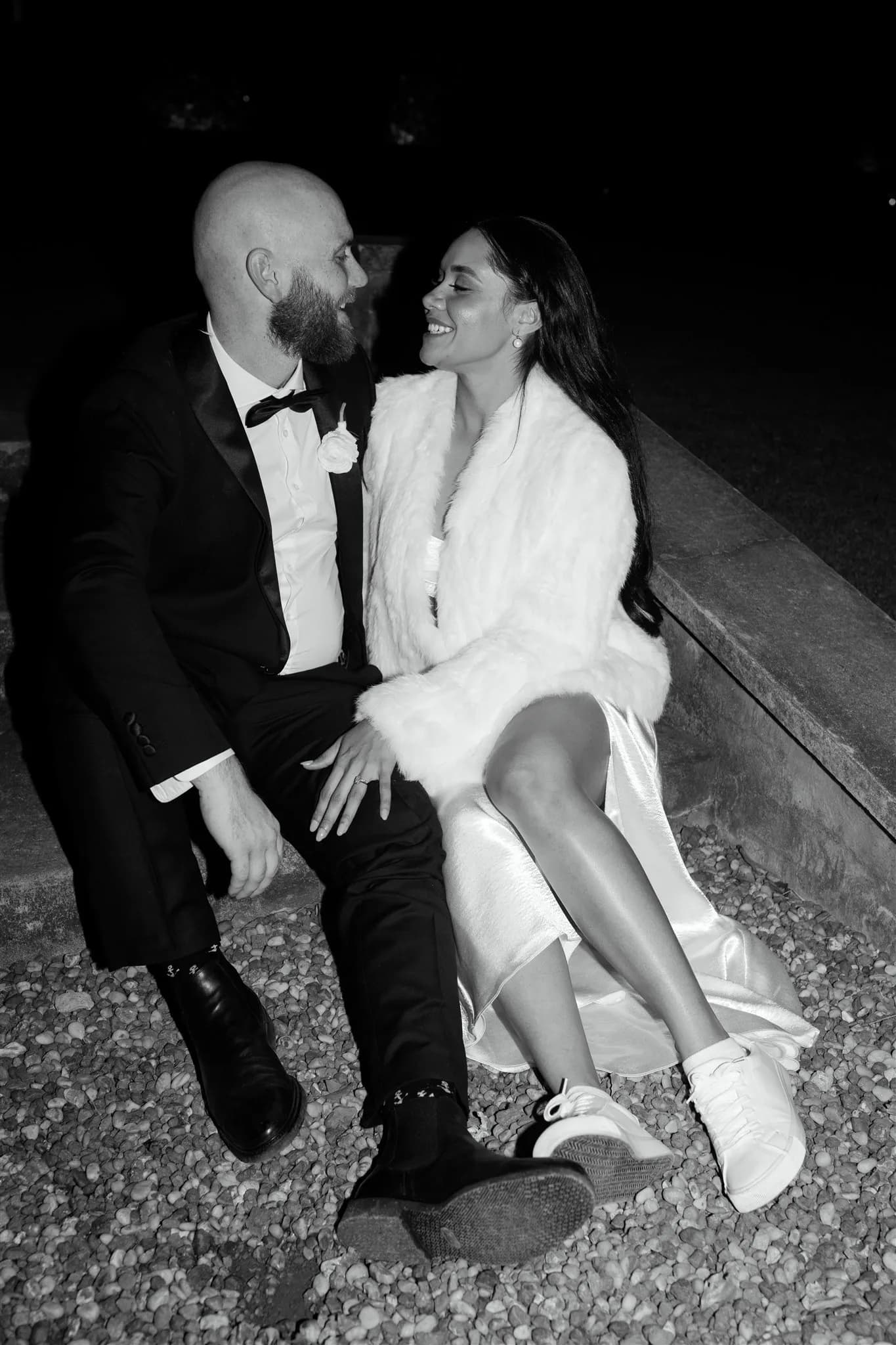 Bride and groom sitting on steps