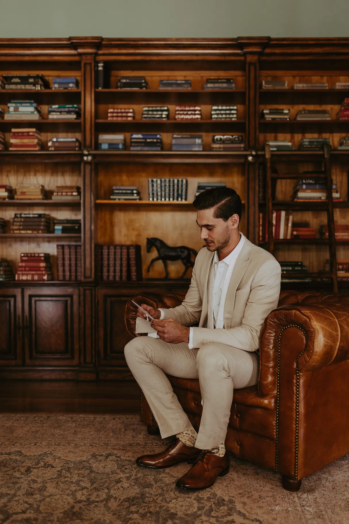 Groom reading letter from bride