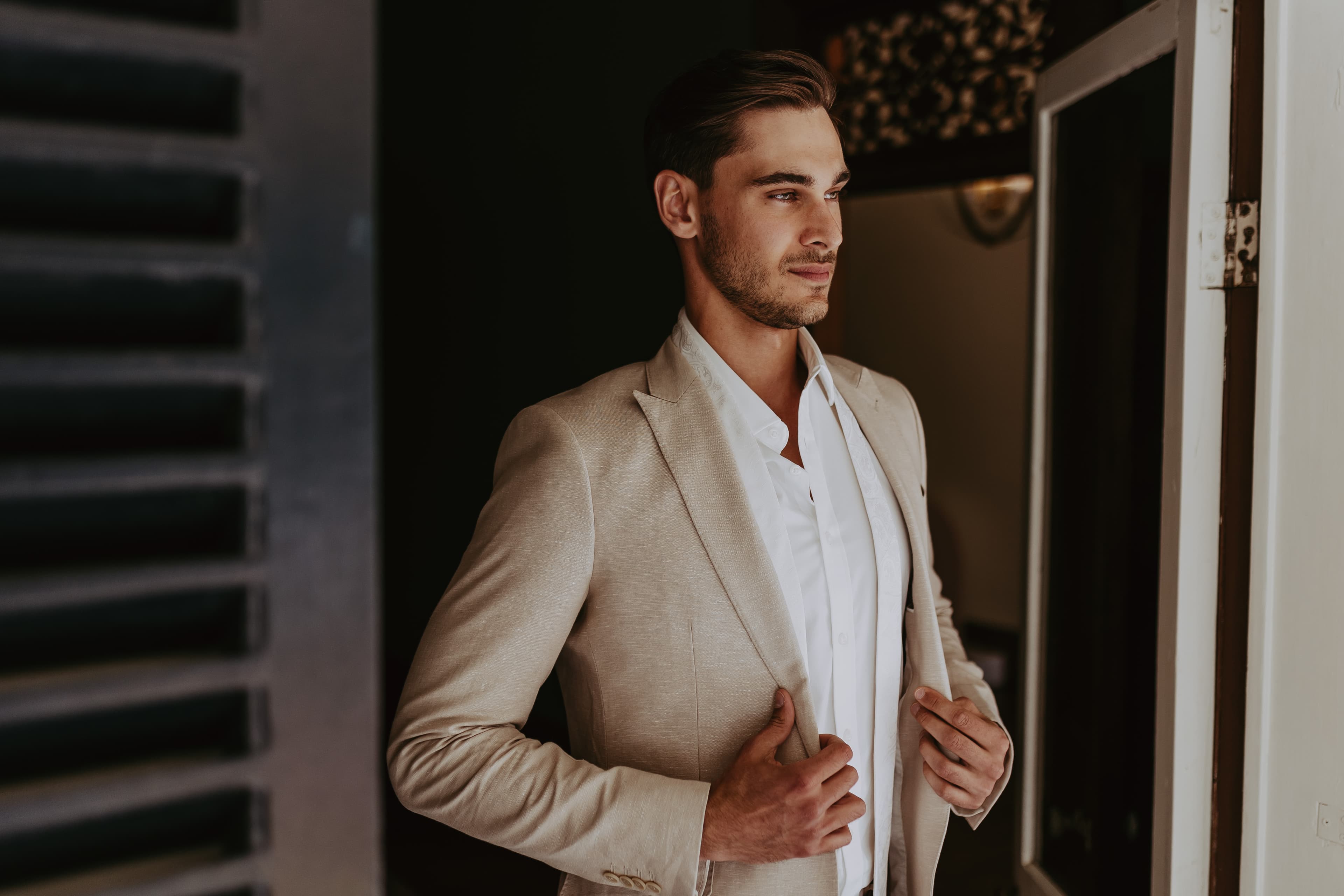 Groom wearing linen jacket