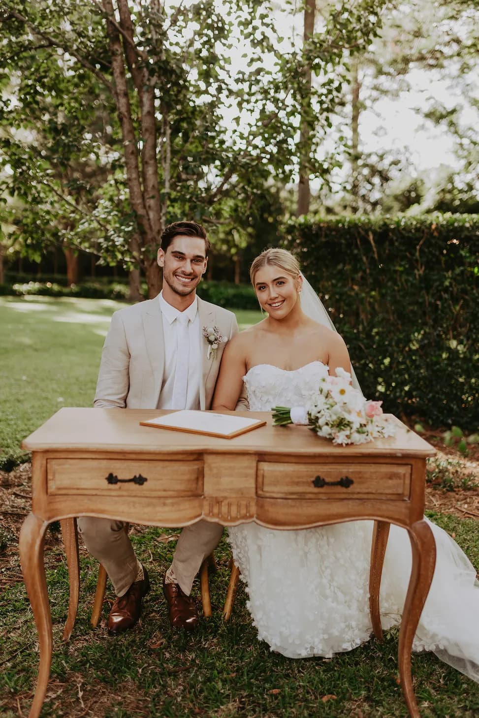 Bride and groom signing wedding register