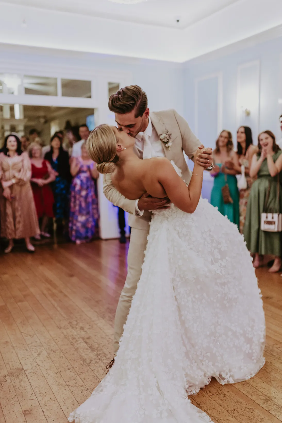 Bride and groom dancing in ballroom