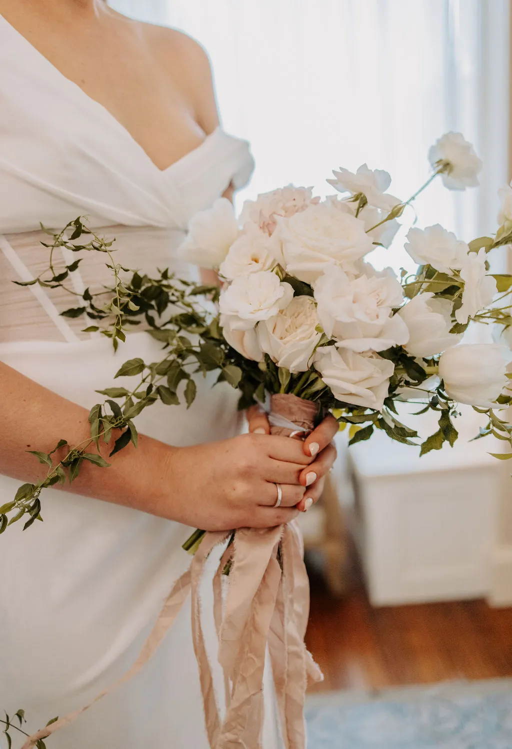 Bride holding bouquet of flowers