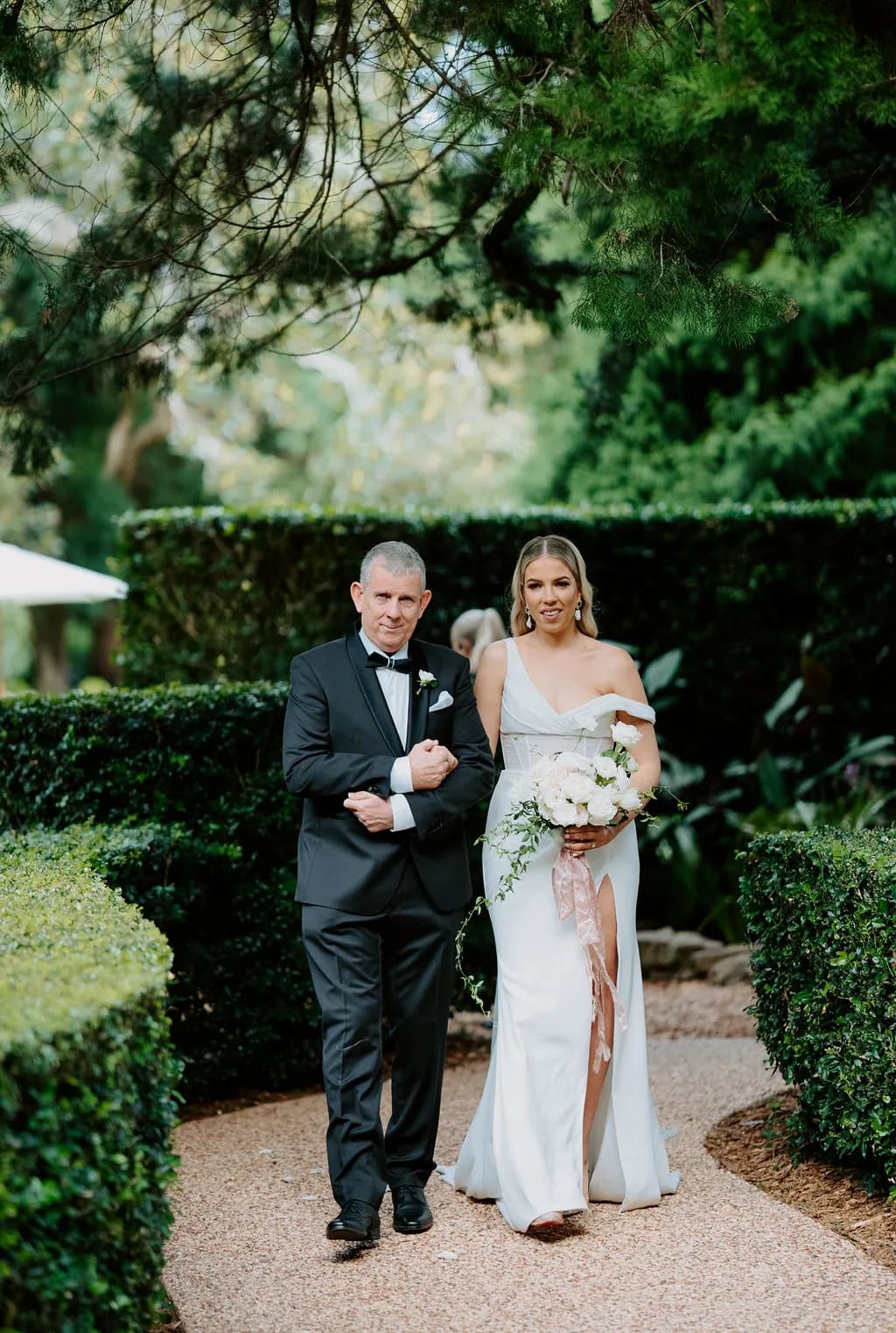 Bride and father walking down the aisle