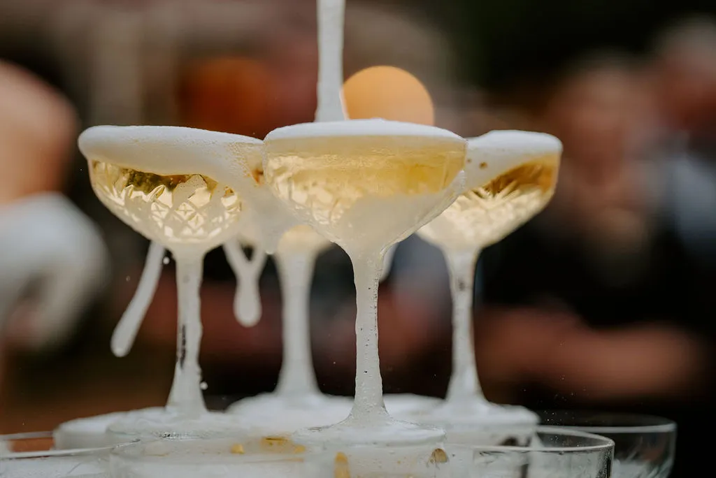 Glasses of champagne being poured