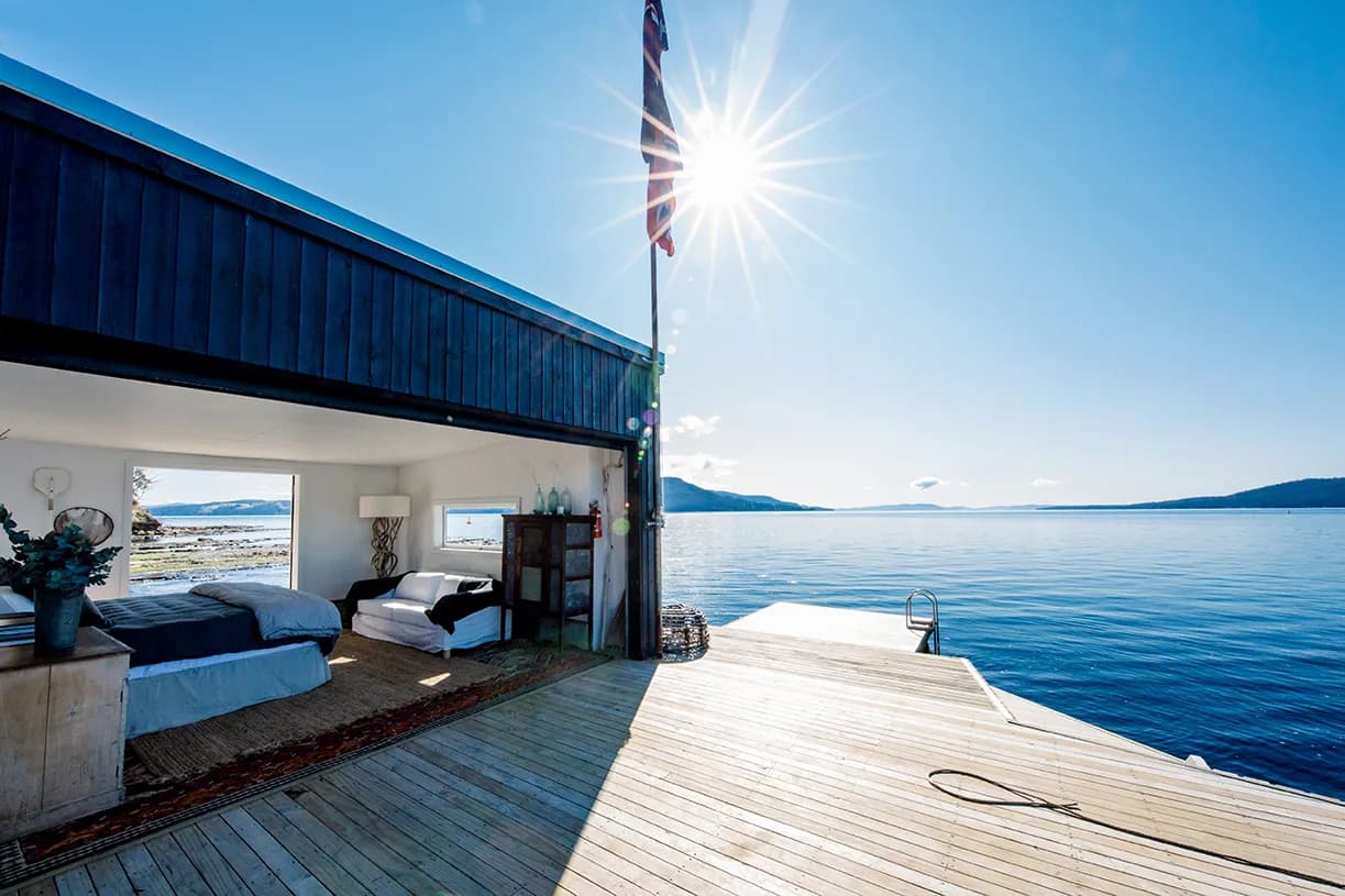 A Wooden Cabin Beside A Lake At Satellite Island, Tasmania