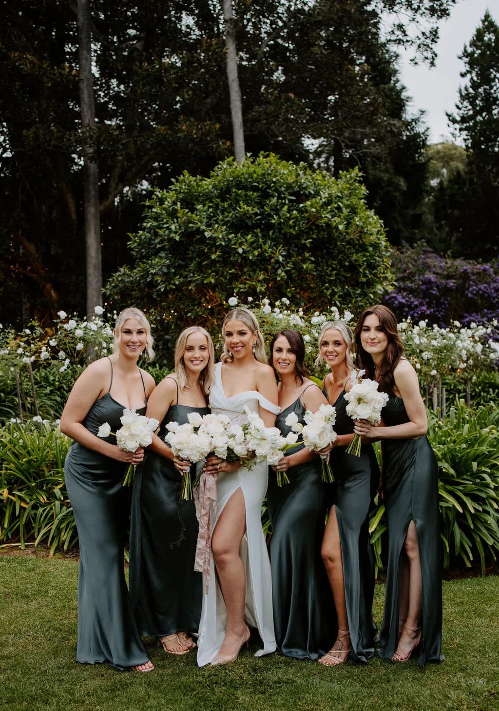 Bride and bridesmaid holding flowers