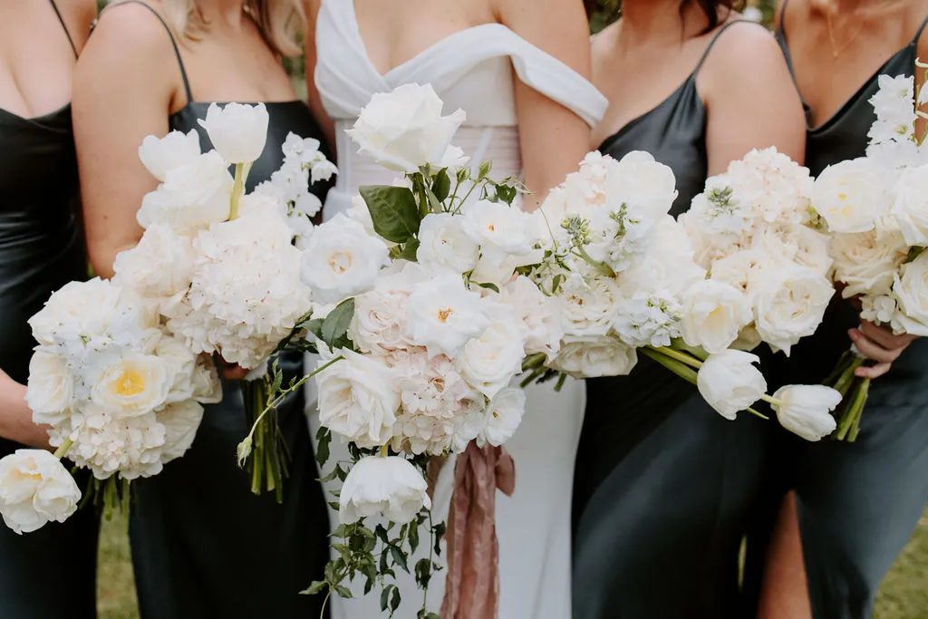 Bride and bridesmaids holding bouquet