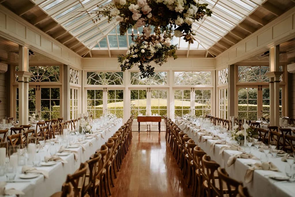 Wedding reception with cake and hanging flowers