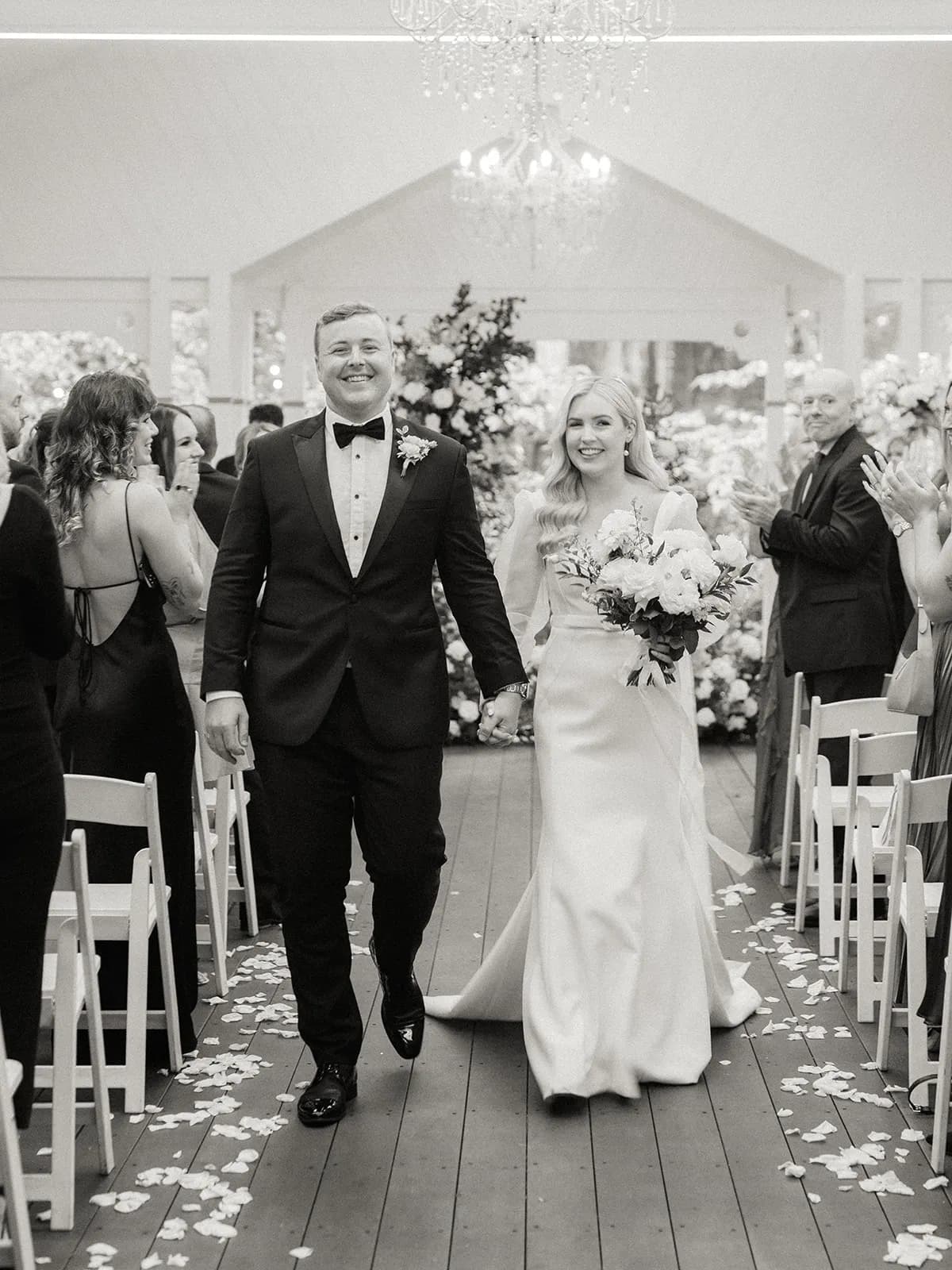 Bride and groom walking down the aisle