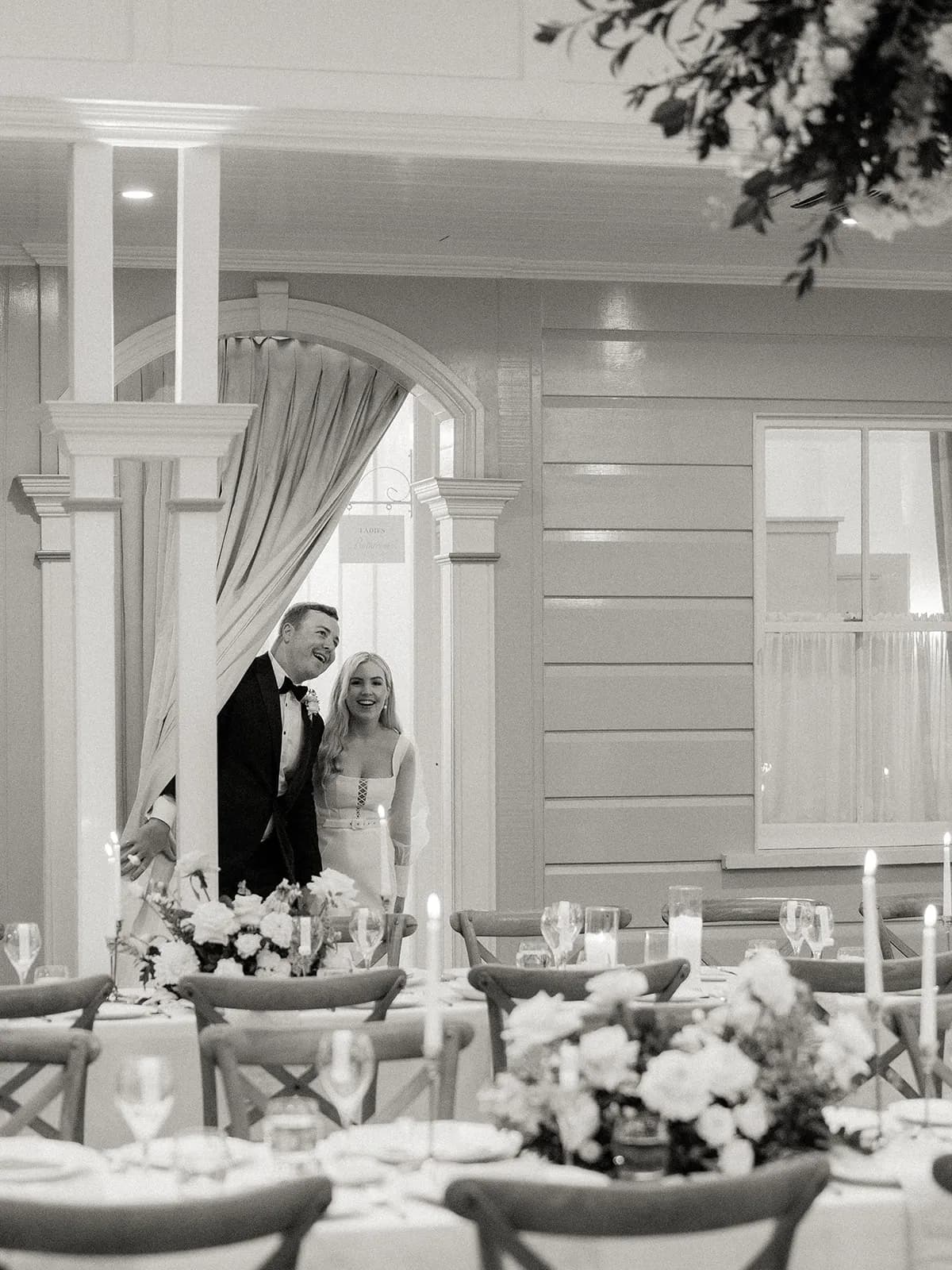 Bride and groom walking into wedding venue