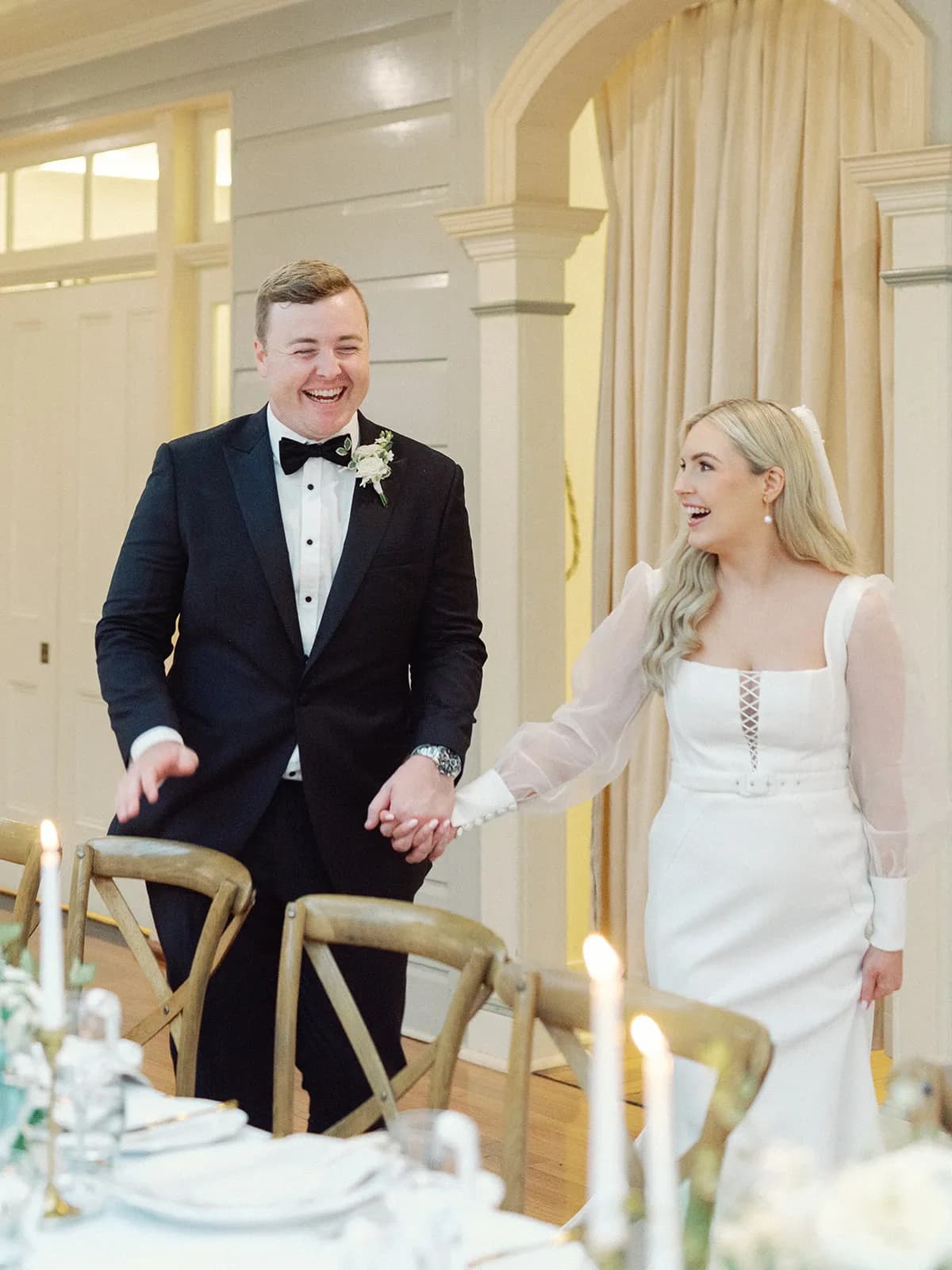 Bride and groom laughing together