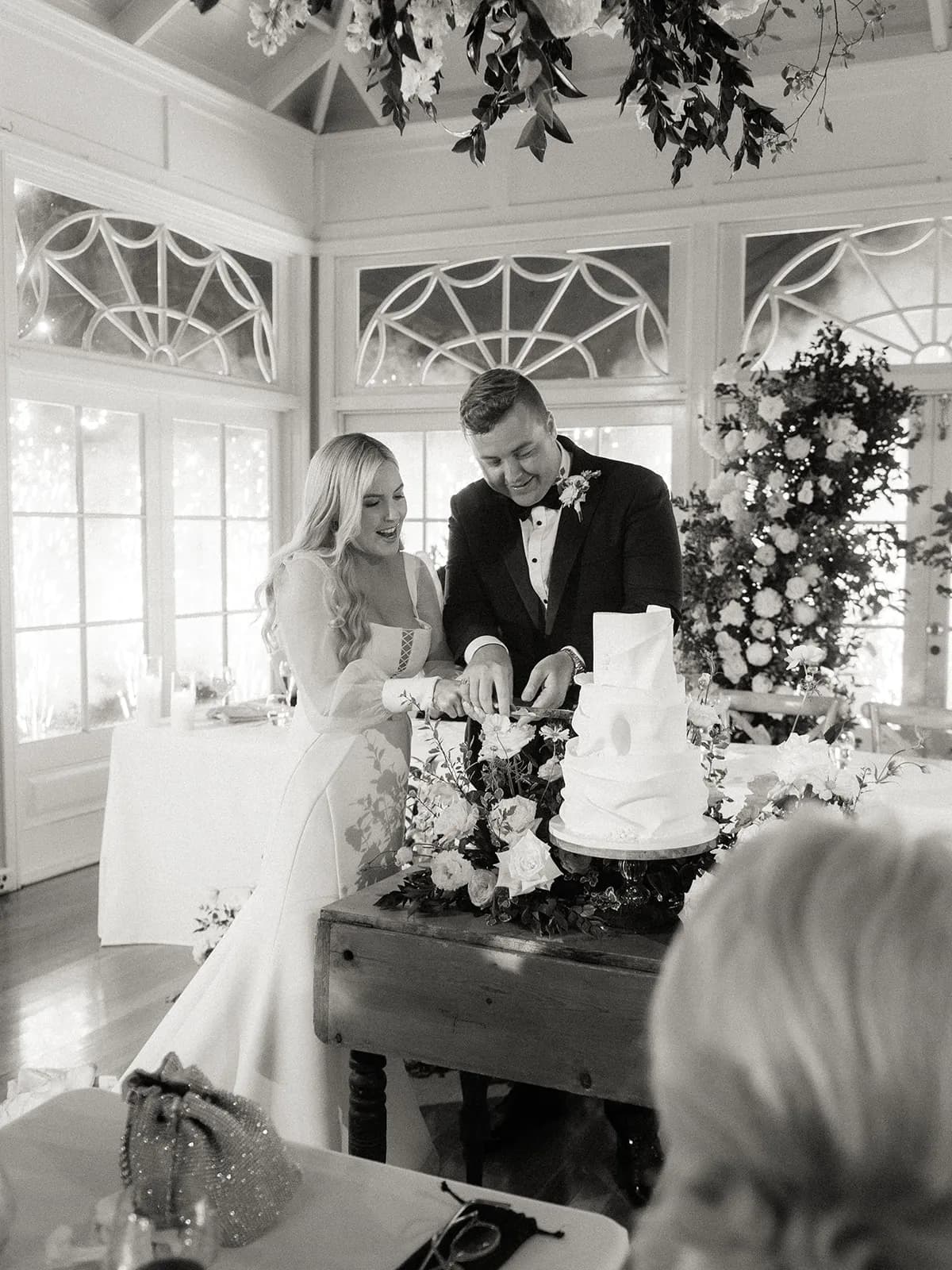 Bride and groom cutting the cake