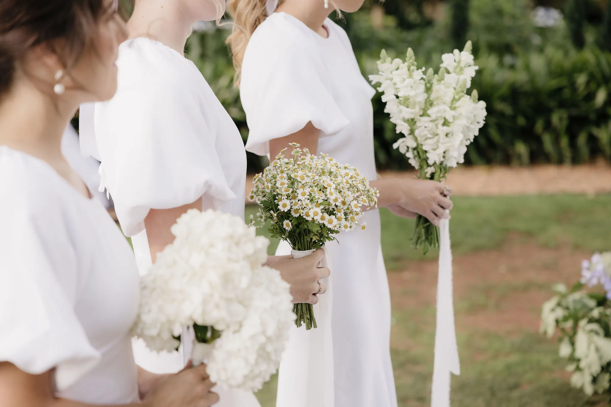 Bridesmaids holding flowers