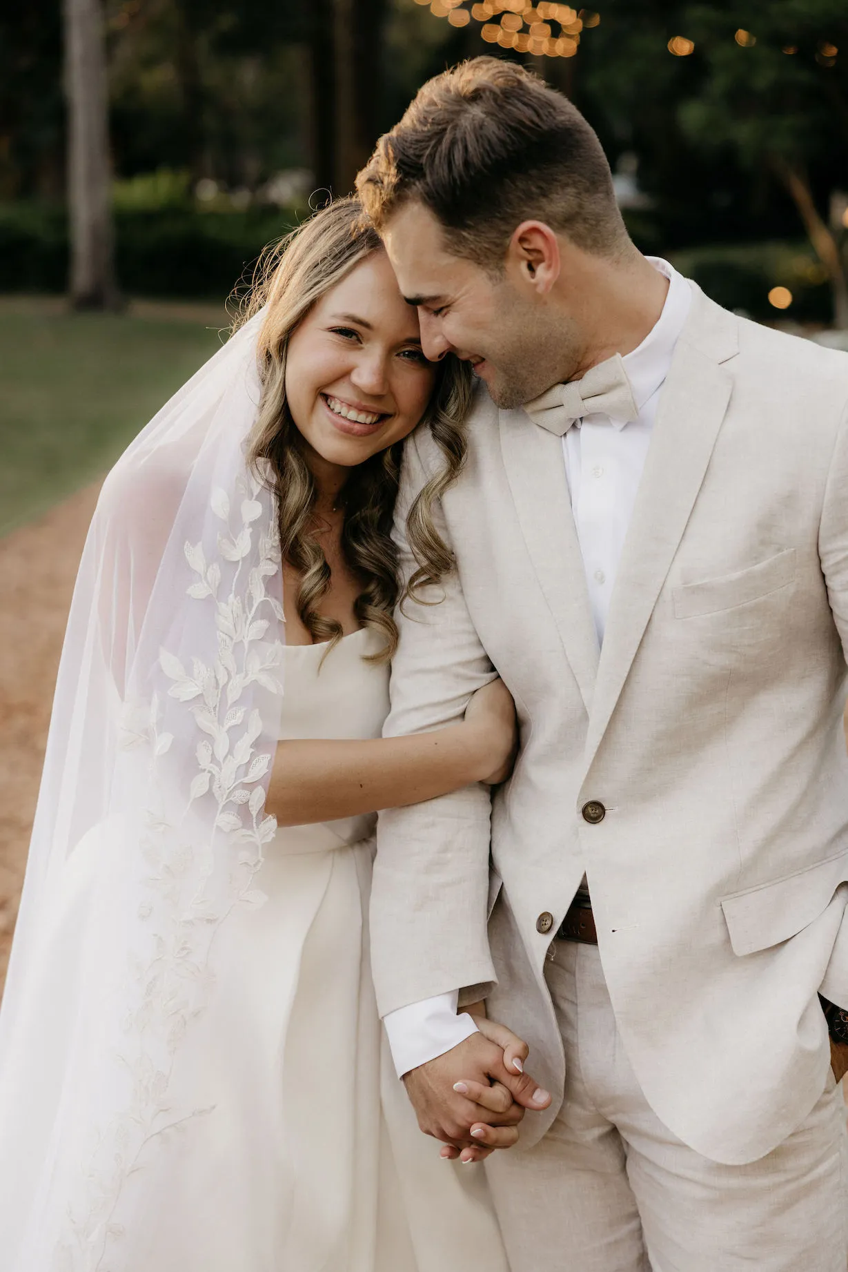 Bride and groom holding hands