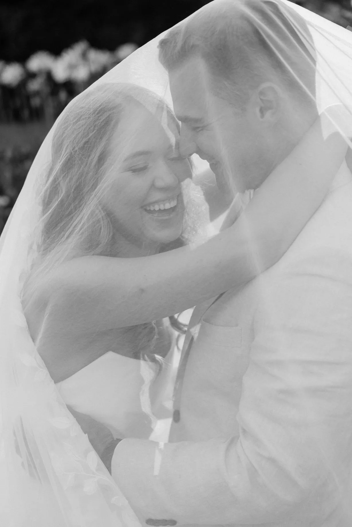 Bride and groom hugging and laughing