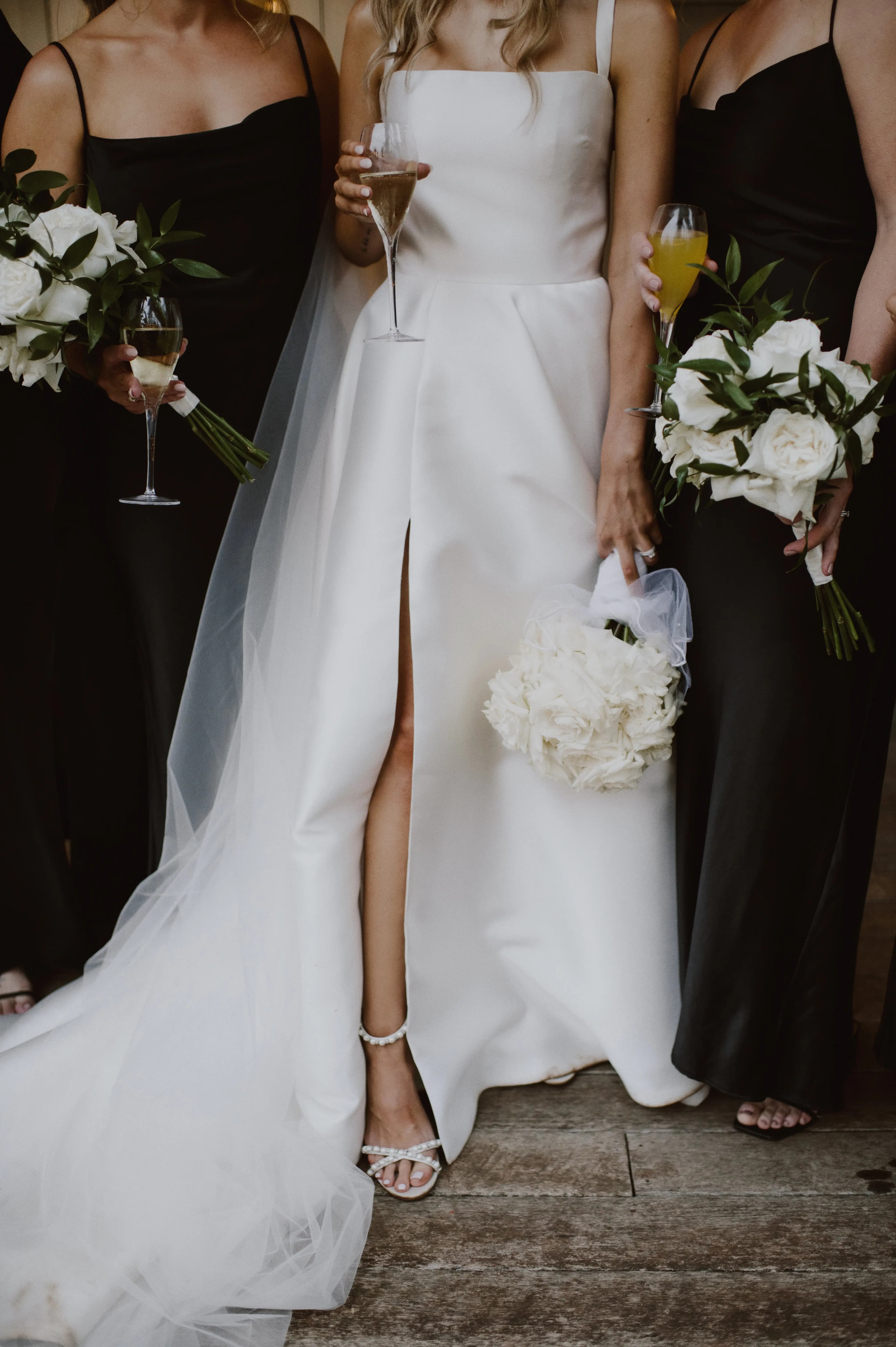 Bride with bridesmaids with shoes and flowers