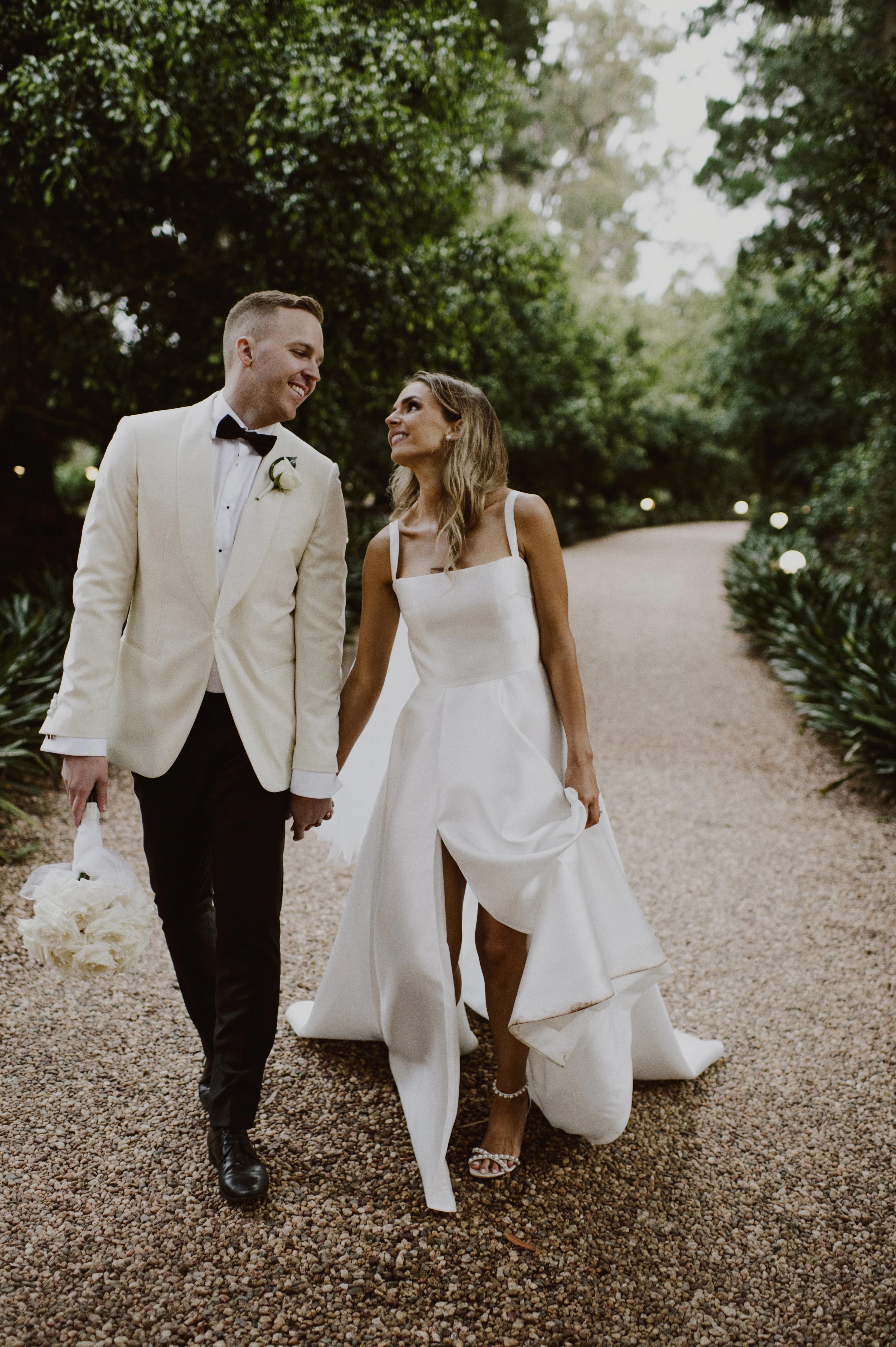 Couple walk along the Gabbinbar driveway