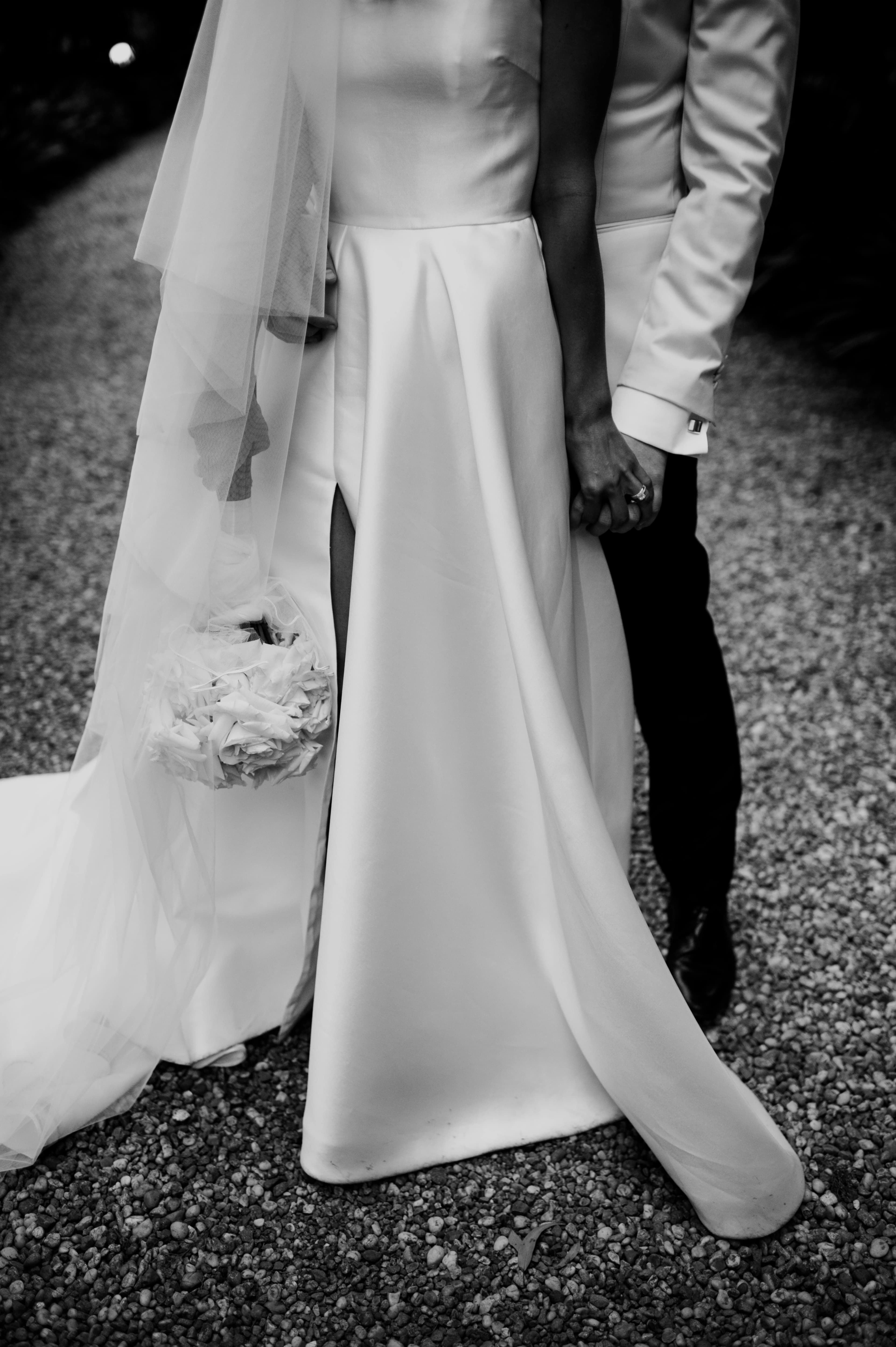 Bride and groom hold hands