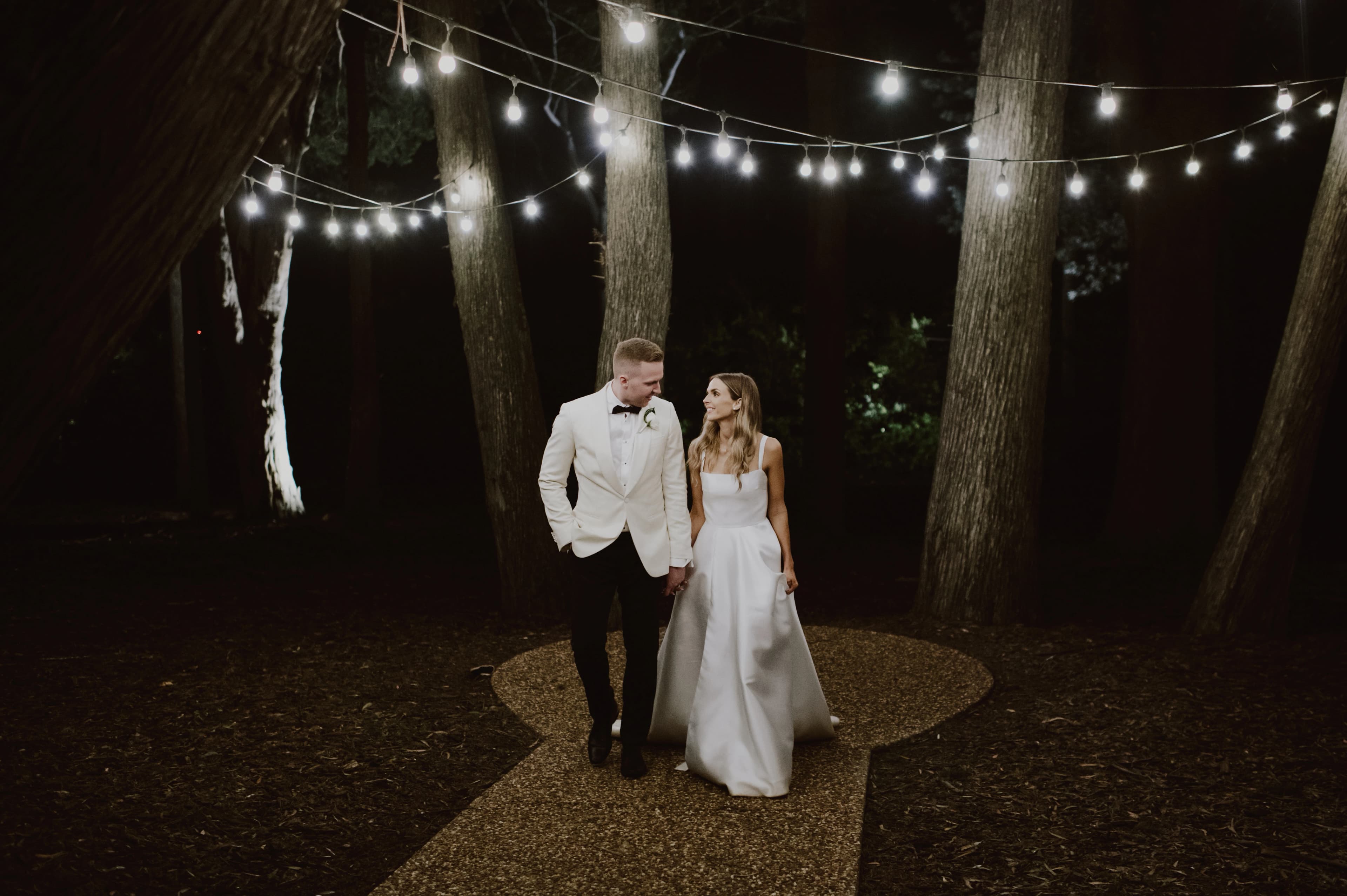 Couple walk in The Woods hand in hand