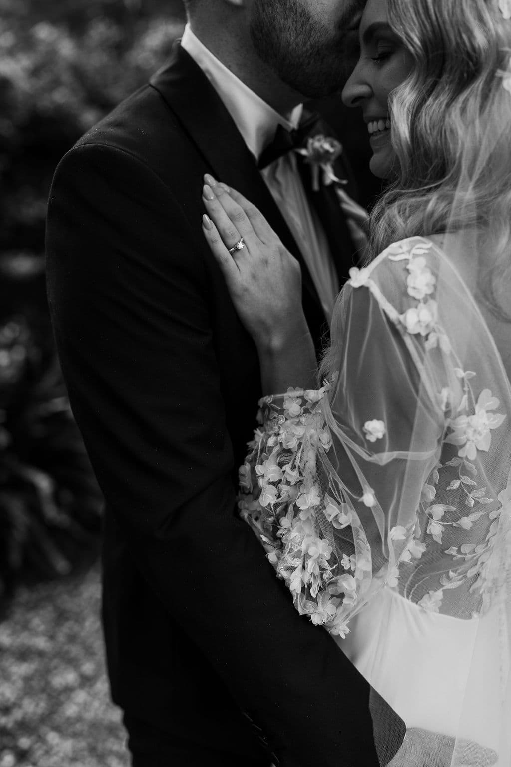 Bride and groom embracing