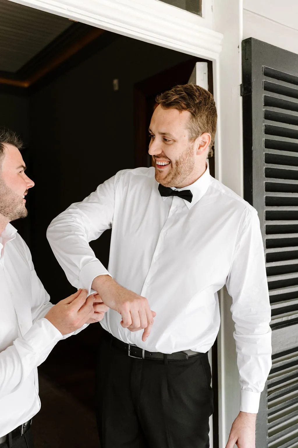 Groom doing up cufflinks