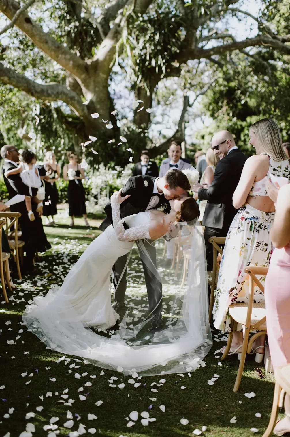 Bride and groom kissing at wedding ceremony