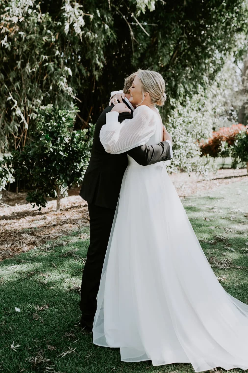 Bride and groom hugging