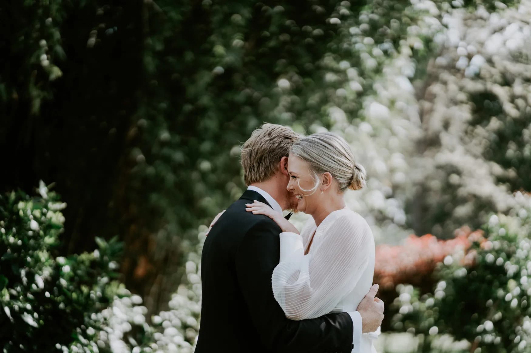 Bride and groom hugging