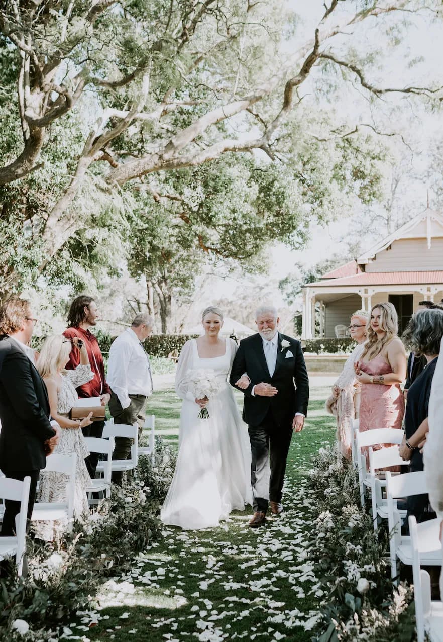 Bride and father walking down the aisle