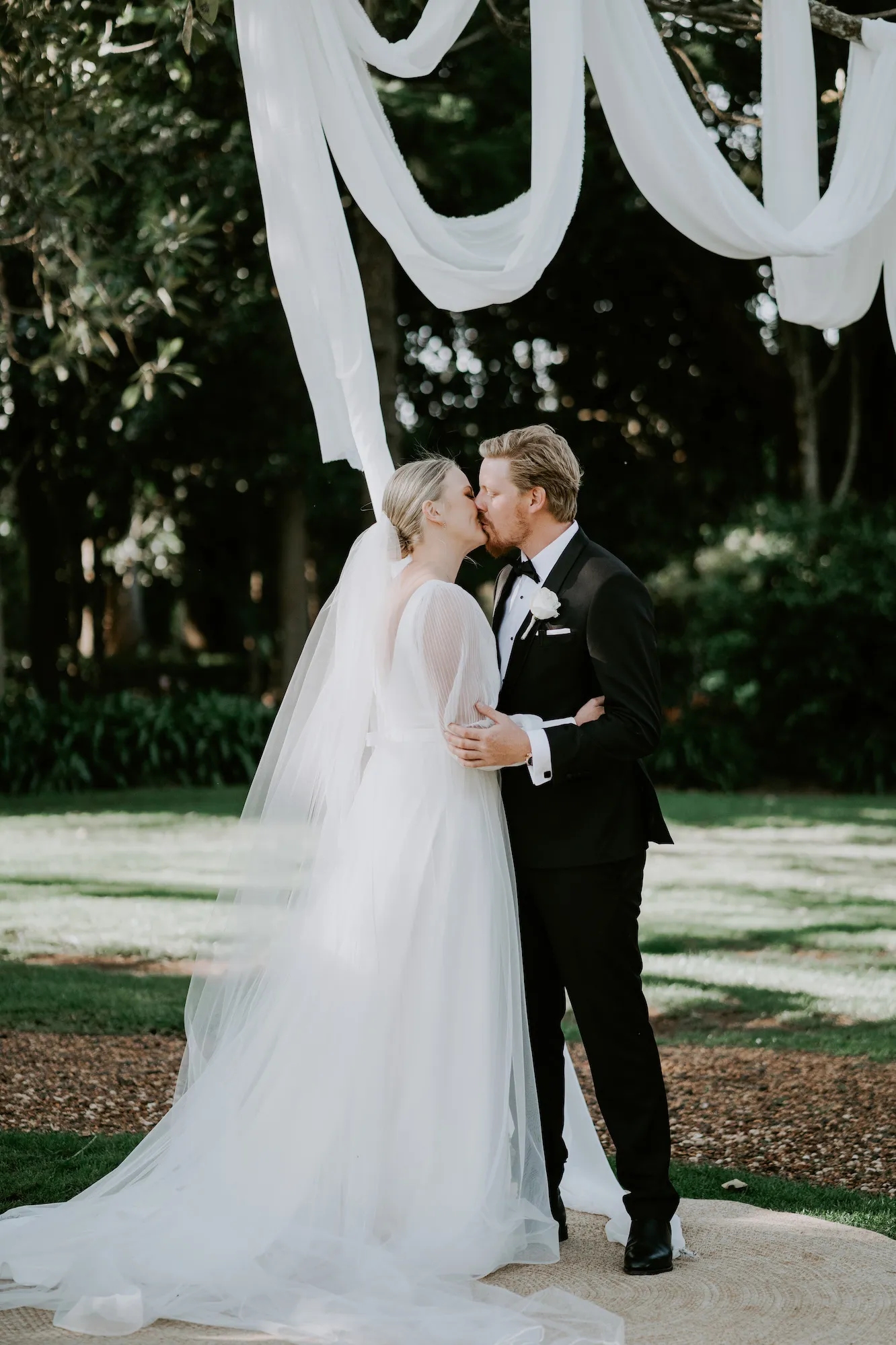 Bride and groom kissing