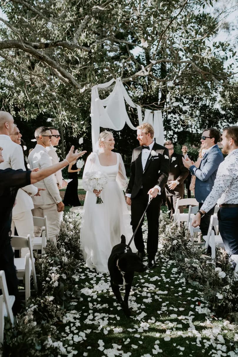 Bride and groom walking down the aisle