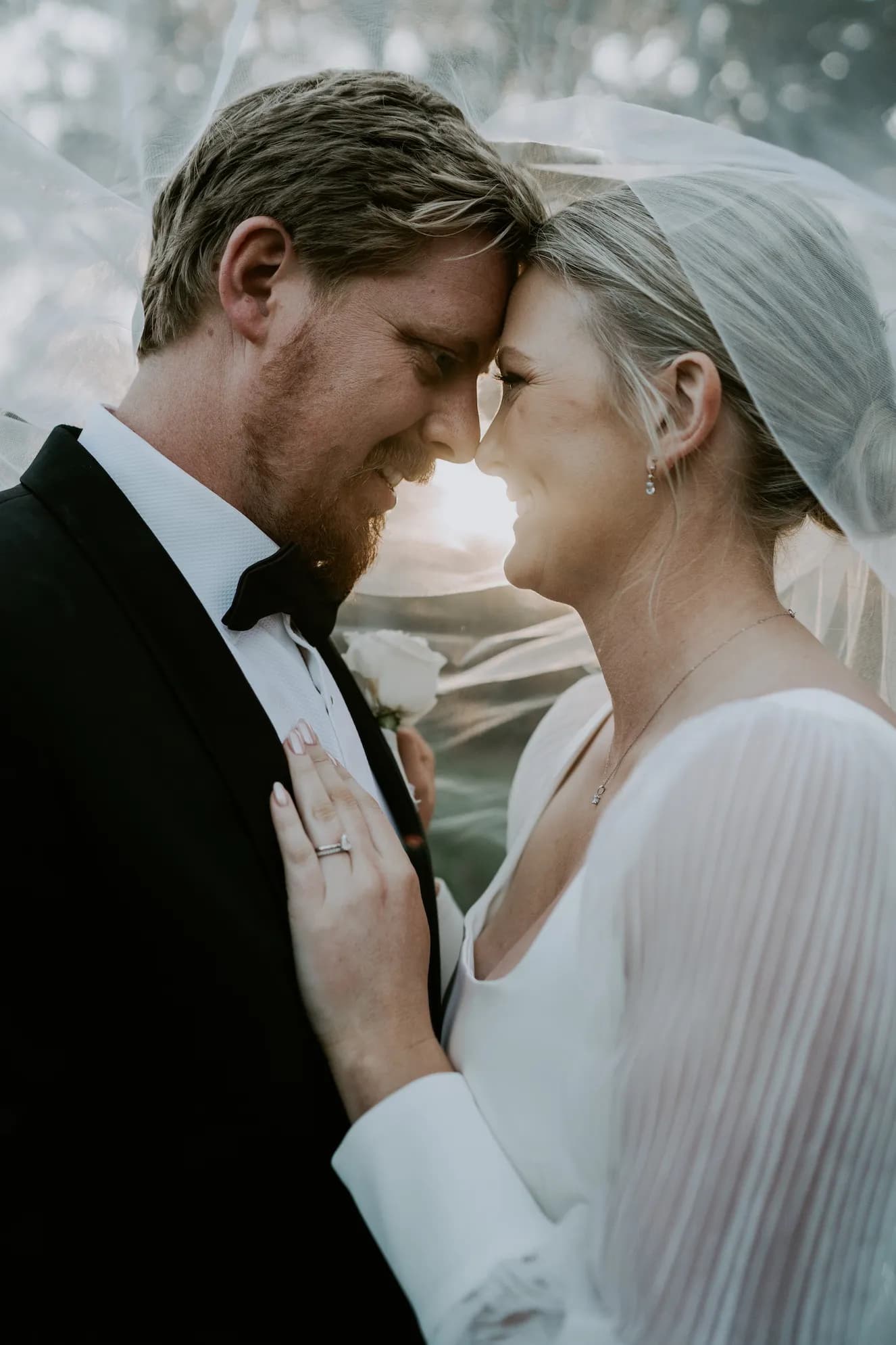 Bride and groom with veil