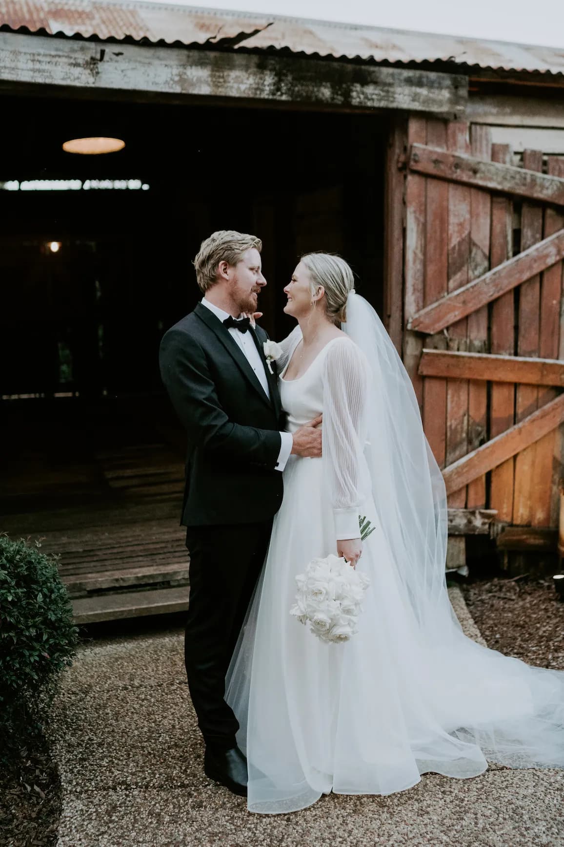 Bride and groom in stables