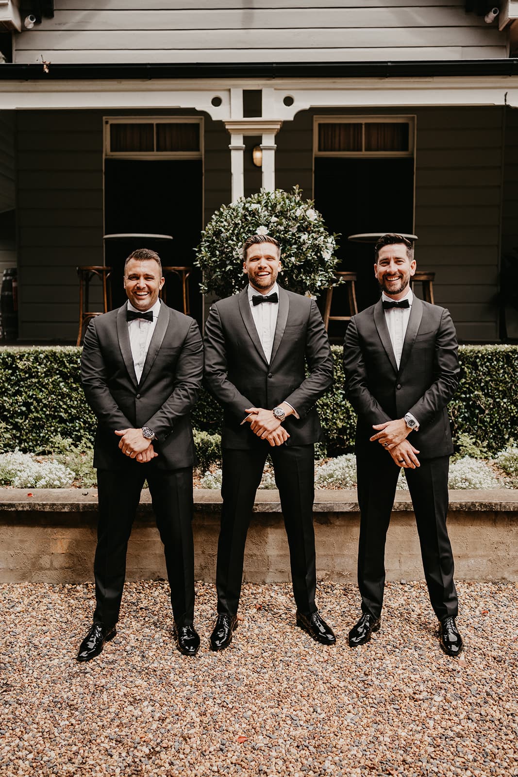 Groom and groomsman standing together